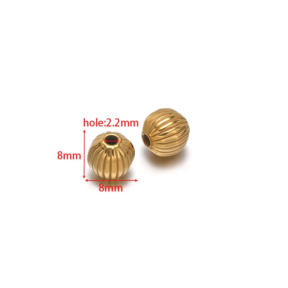 Gold striped pumpkin spacer beads with red center, 2mm hole, ribbed texture