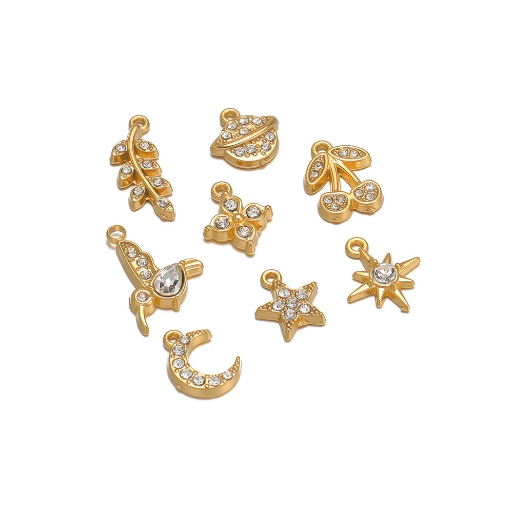 Gold-tone charm set with rhinestones: star, moon, bird, clover, cherry, planet, leaf