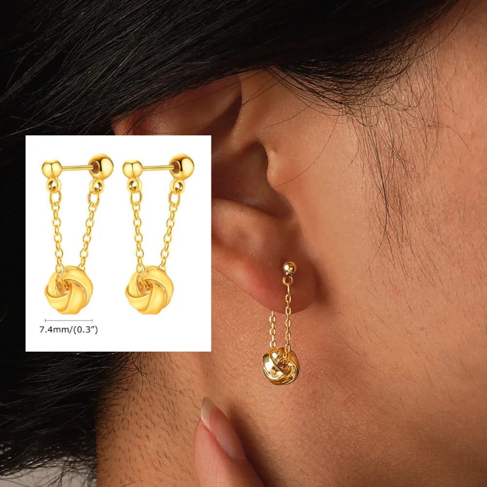 Gold chain drop earrings with ball studs and knot-shaped pendants