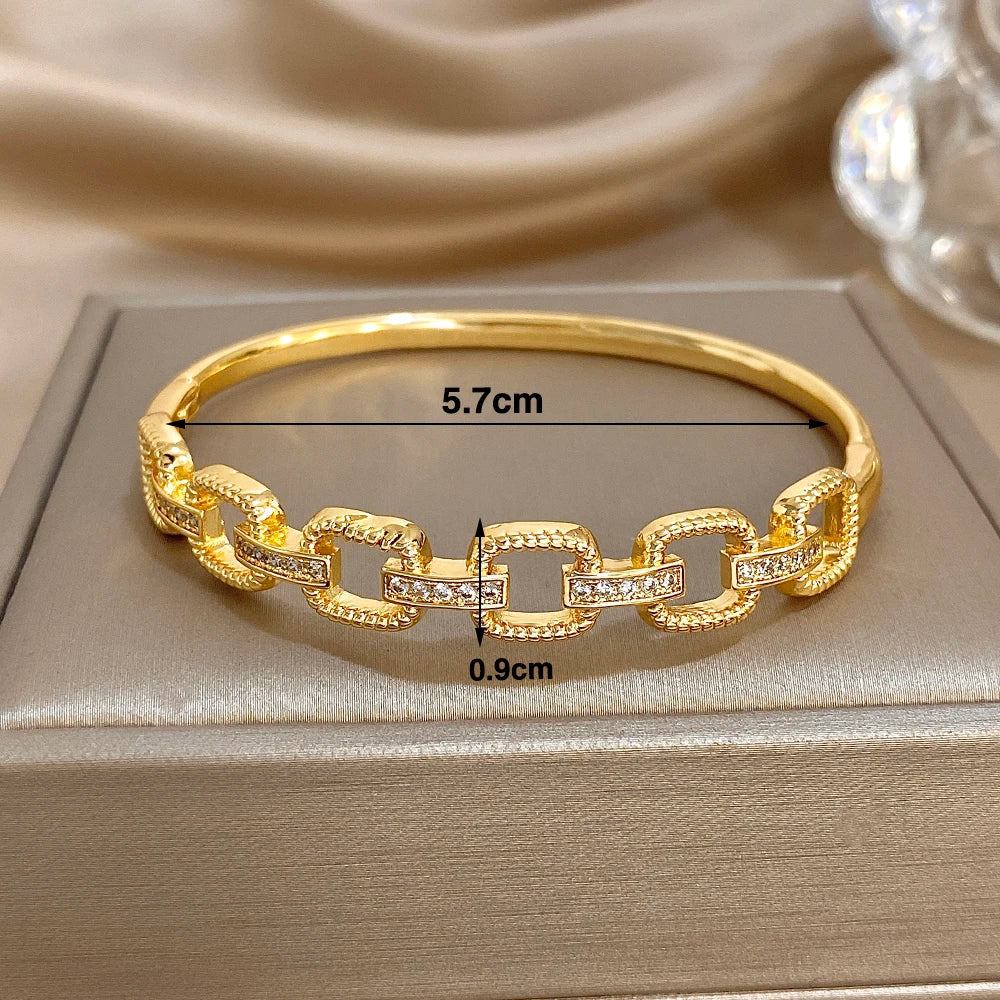 Gold-tone geometric square-link bracelet with zircon insets; 5.7cm x 0.9cm