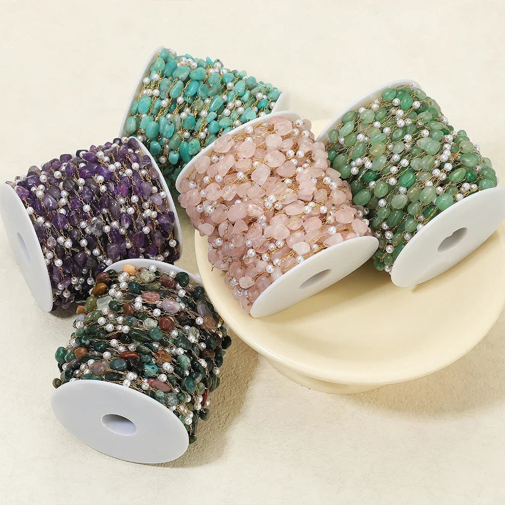 Irregular stone bead chain on gold-toned links with pearl accents, aqua blue pink green mix
