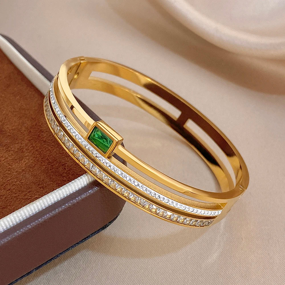 Gold-plated stainless steel cuff bracelet with green zircon and pavé accents