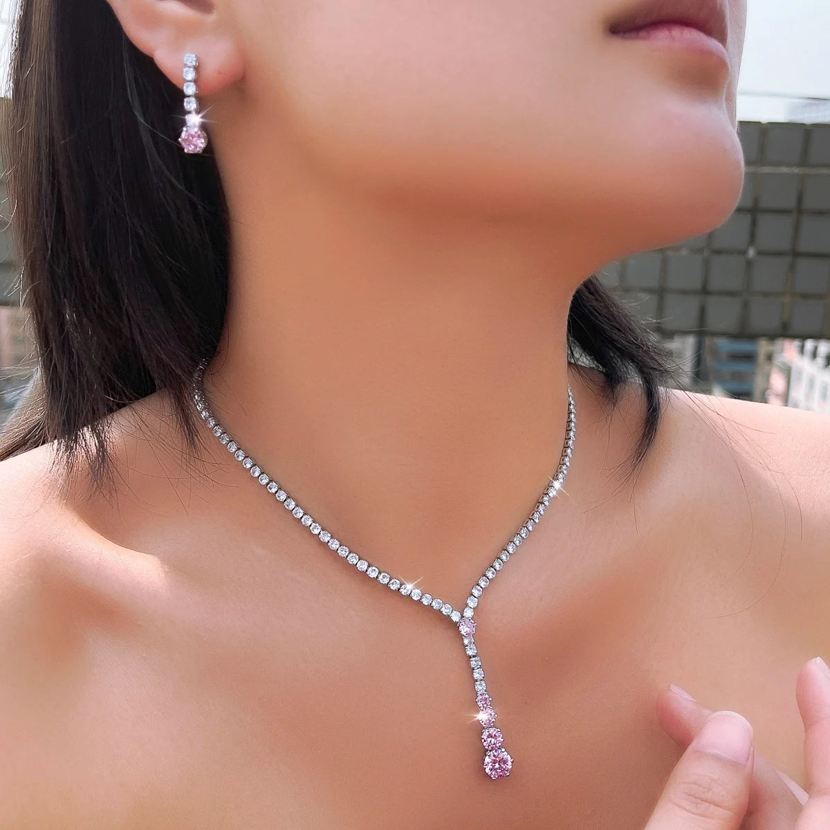 Pink and clear cubic zirconia necklace and drop earring shown worn