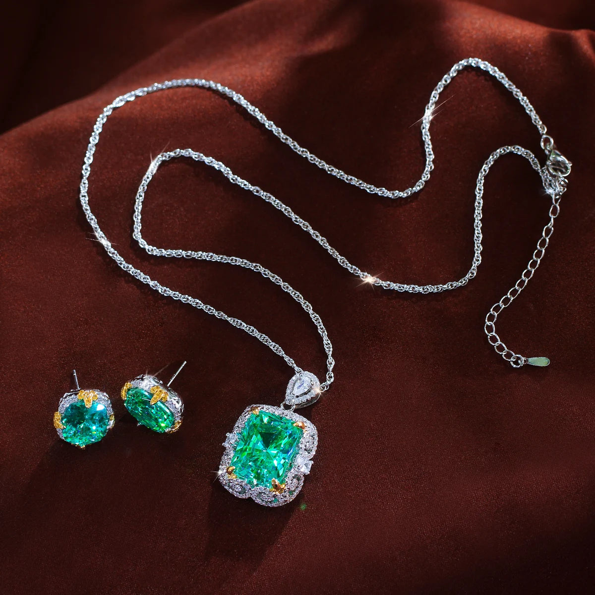 Green crystal pendant necklace with matching stud earrings and adjustable extension chain