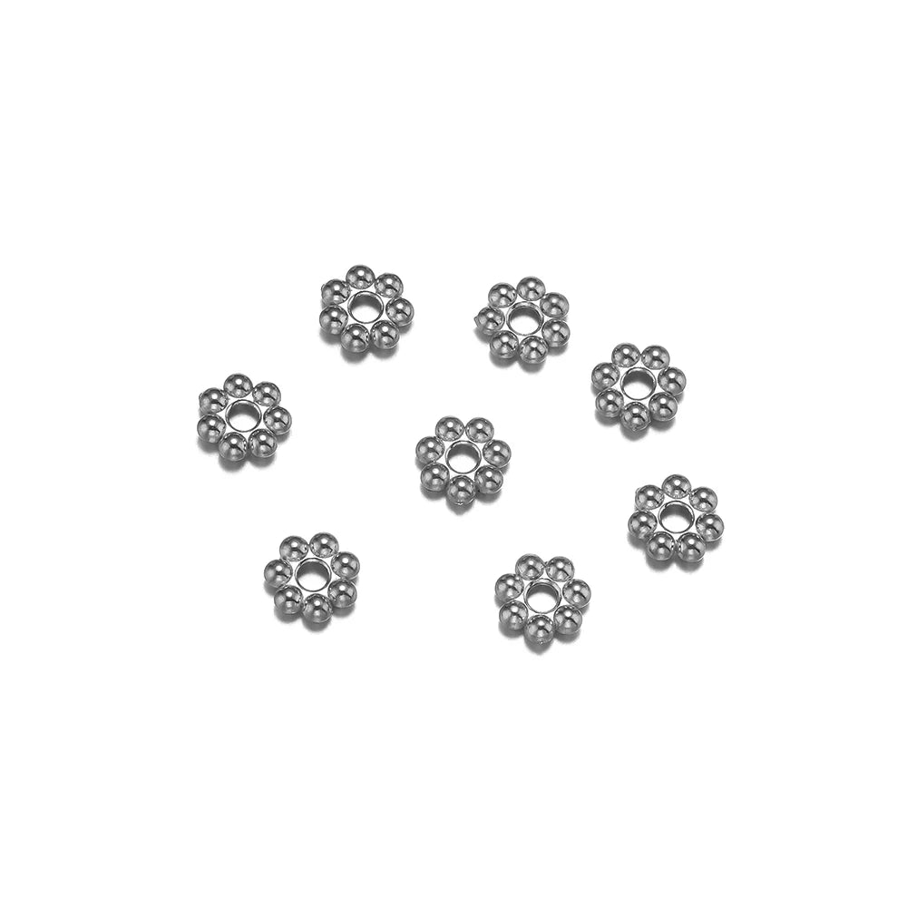 Silver/steel flower-shaped spacer beads, round bead cluster with center hole.