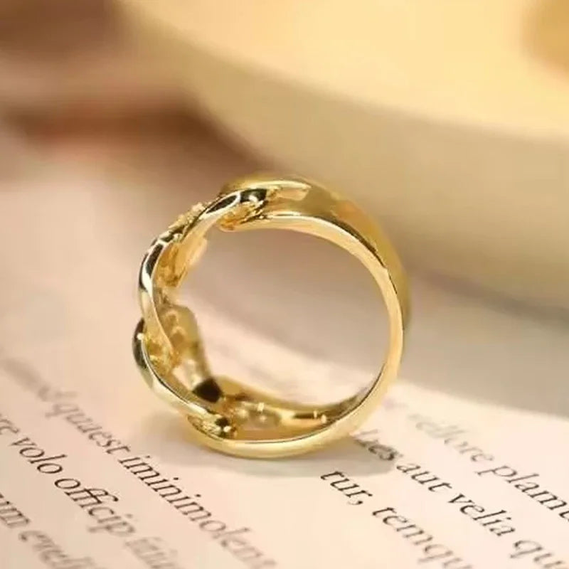 Gold-tone band with openwork chain-link design, smooth back view