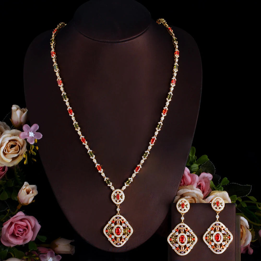 Gold-tone long necklace with red crystal center pendant and drop earring set