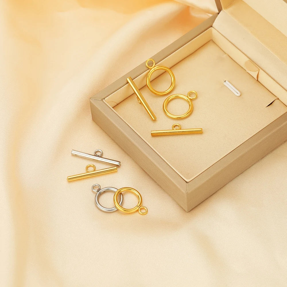Gold-tone OT clasp toggle connectors set with bar and ring loops, arranged in box