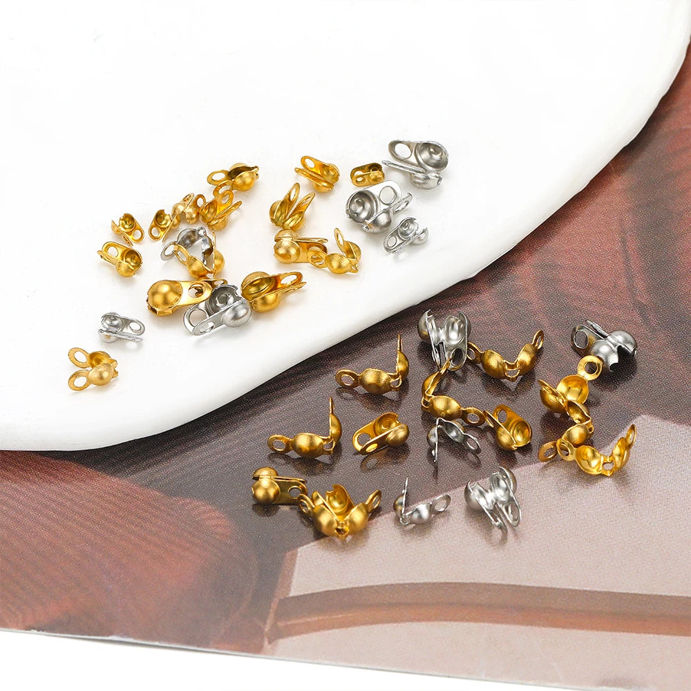 Assorted gold and silver tone end crimp bead hook connectors, small metal findings