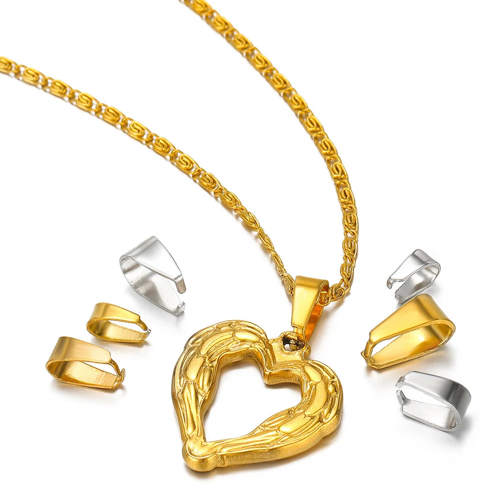 Heart pendant necklace with gold chain and nearby gold and silver clip clasp connectors