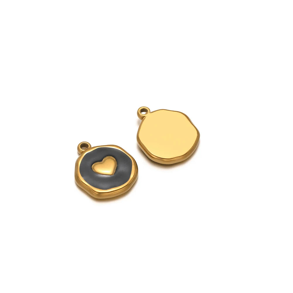 Evil eye charm pendants: dark enamel heart icon with gold border and plain gold drop charm