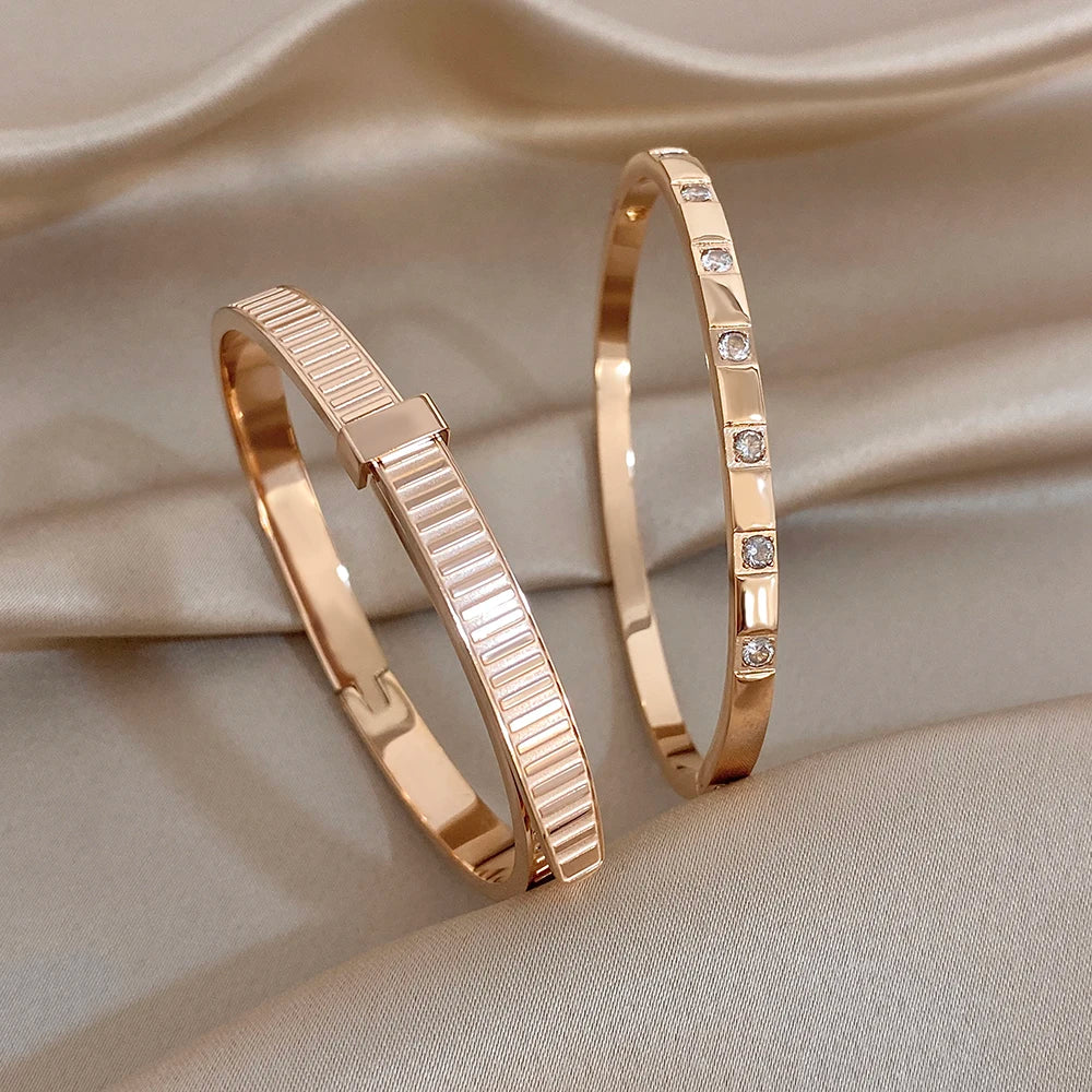 Rose gold stainless steel cuff bangles set with geometric ribbed front and small stones