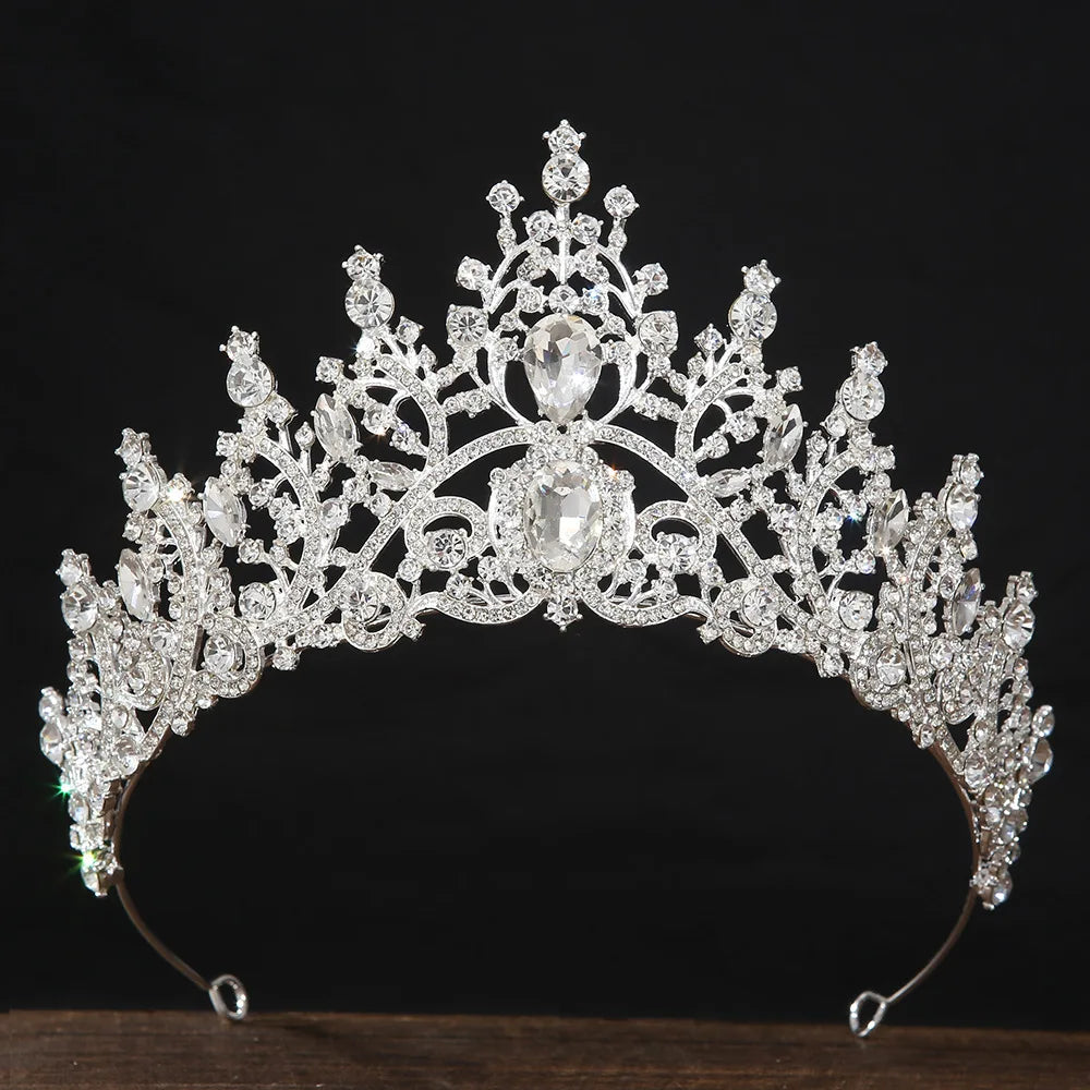 Silver rhinestone tiara crown with central crystal and side teardrops