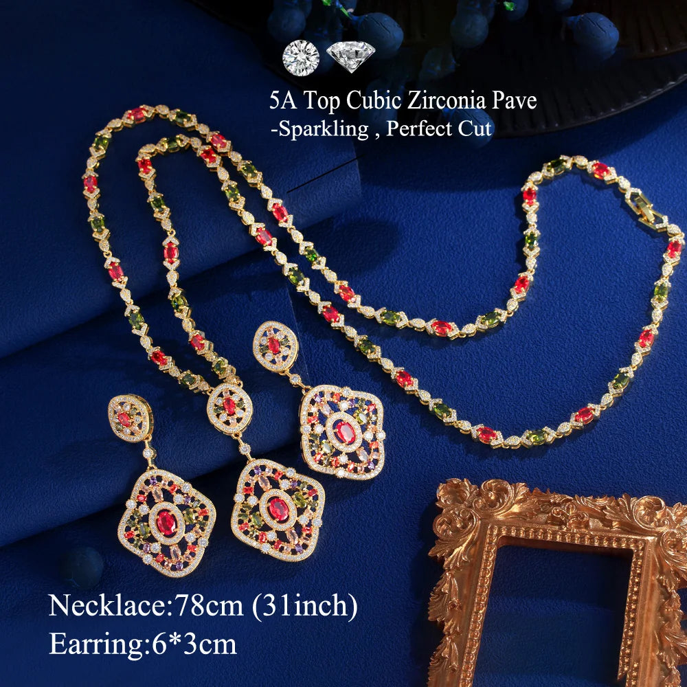 Geometric gold-tone necklace with red and green crystals and matching earrings