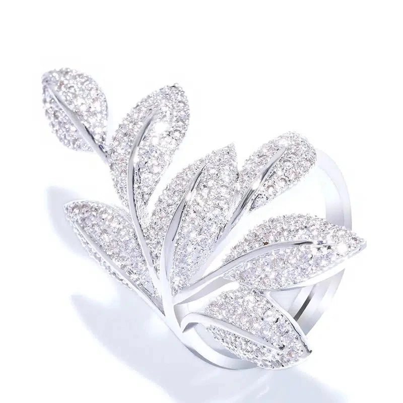 Leaf-shaped cubic zirconia ring with clustered pavé stones in silver-tone setting