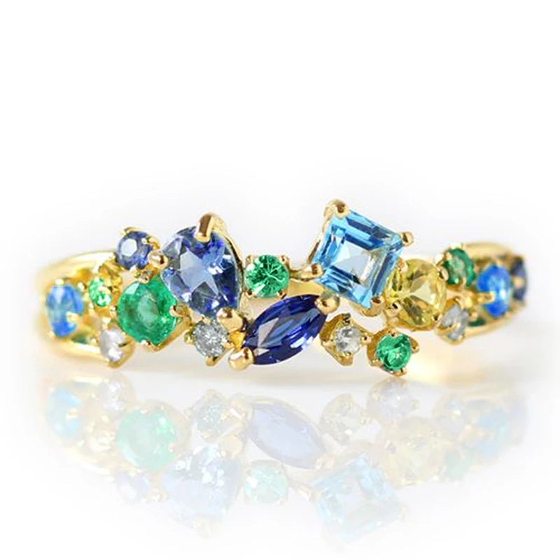 Gold-tone multicolor cubic zirconia ring featuring blue and green center stones