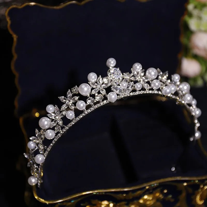 Silver bridal tiara with pearl-like beads and crystal flower rhinestone details
