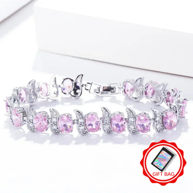 Silver-tone bracelet with pink oval crystals and leaf-shaped crystal links