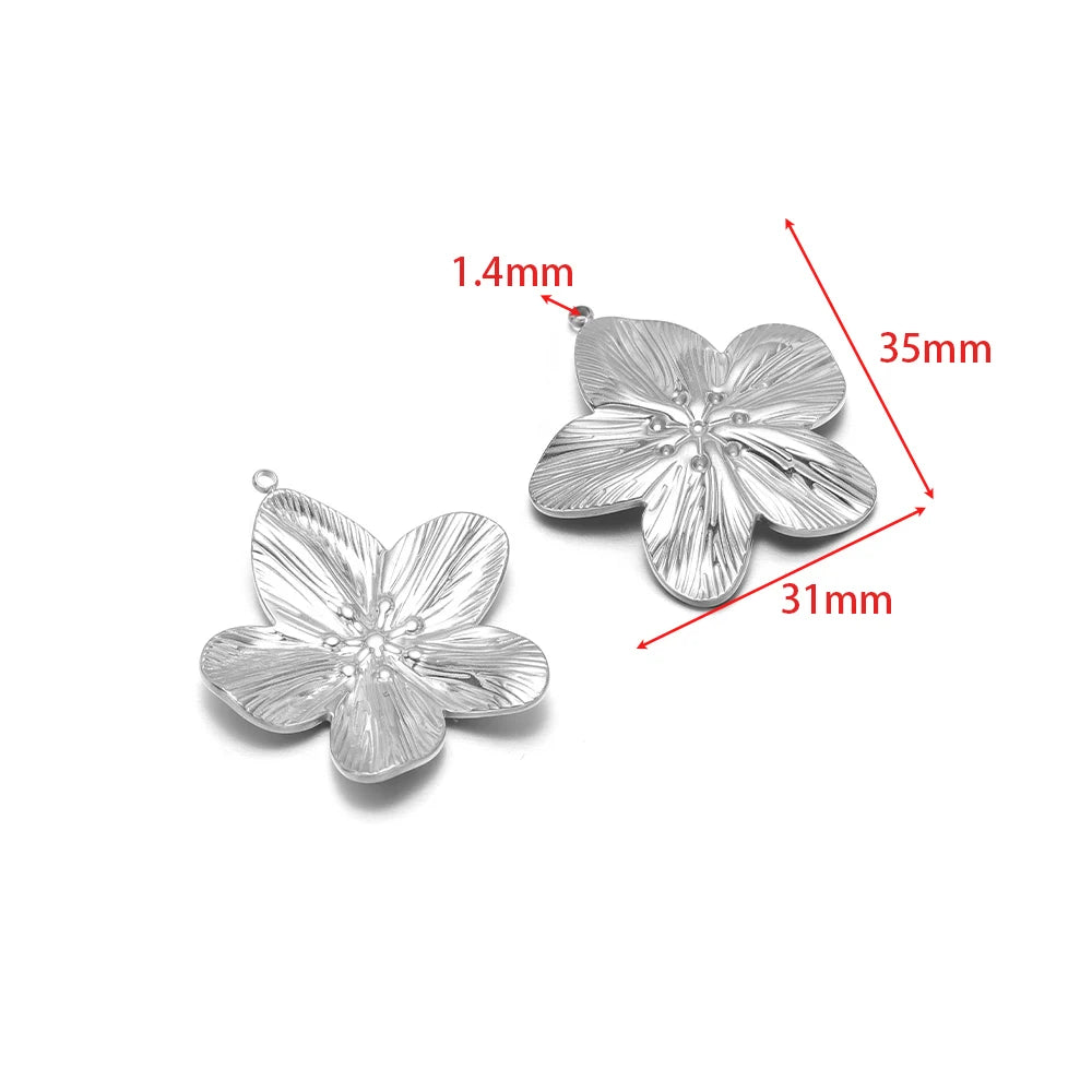 Silver flower/starfish charm pendant with embossed petals and hanging loop