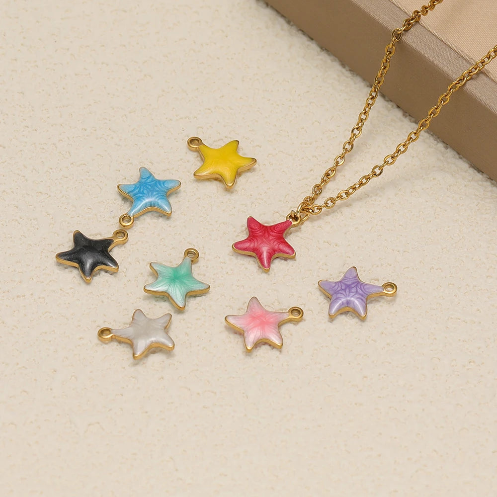 Assorted enamel star charms with gold-tone loops, plus a matching necklace chain