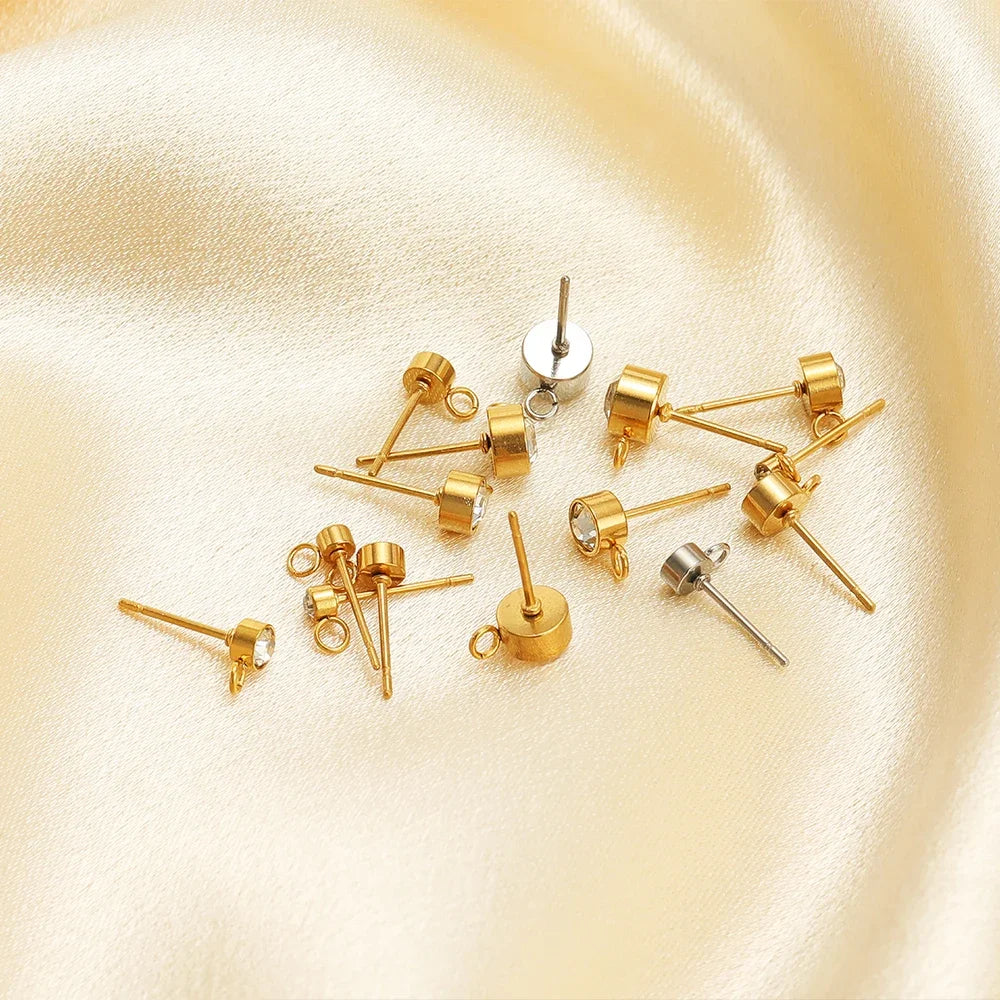 Gold-tone zircon stud earring posts with round crystals and loop backs