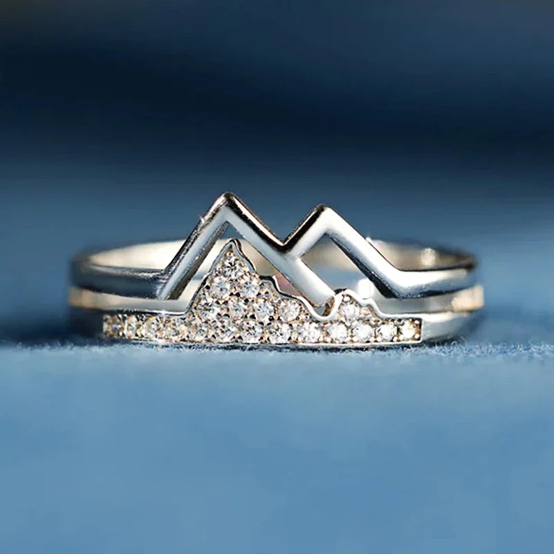 Silver-tone mountain-shaped cubic zirconia ring with sparkling center peak