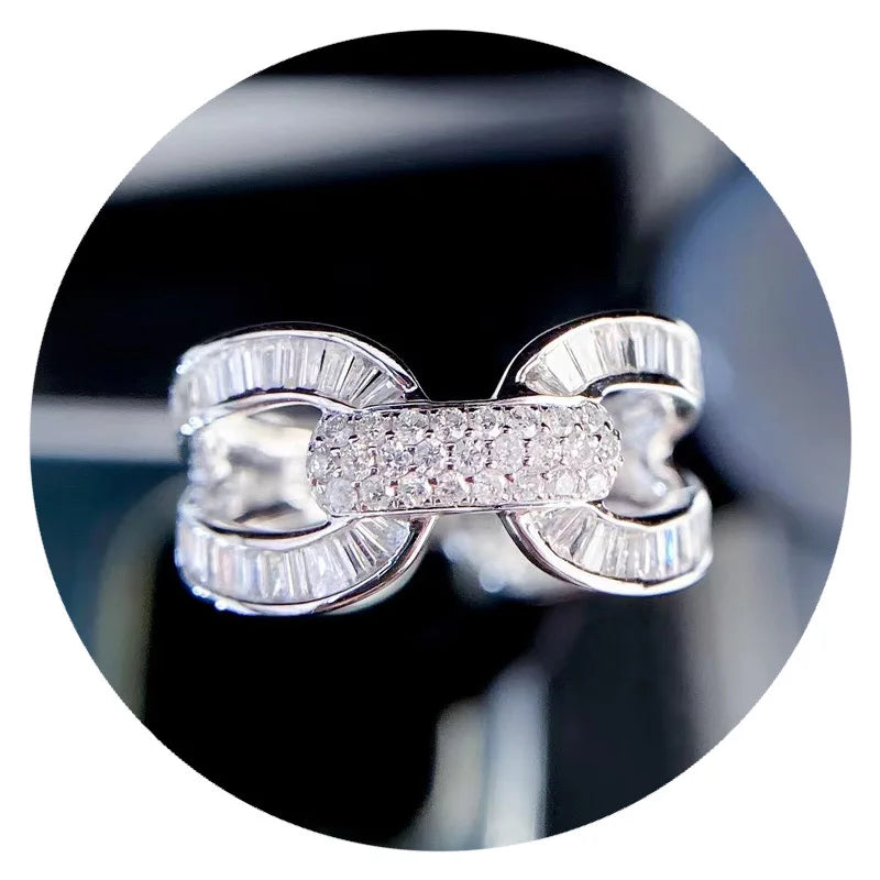 Silver-tone wedding ring with split band and pavé center