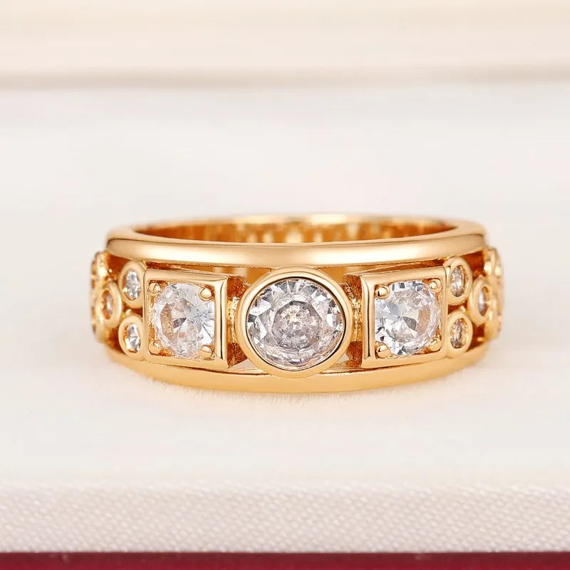 Gold-tone CZ ring with three square and round clear stones