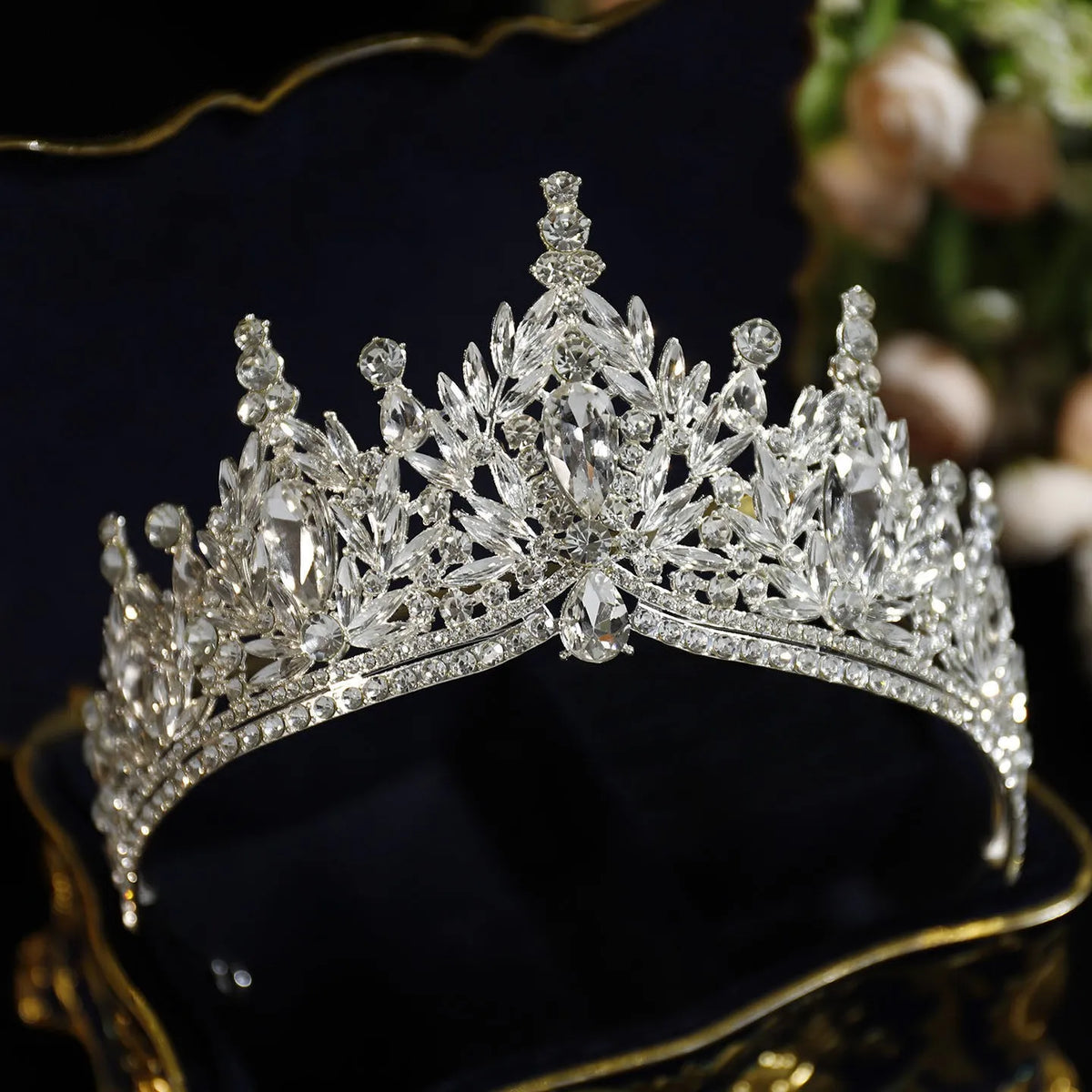 Silver crystal tiara crown with pointed rhinestone clusters and curved band