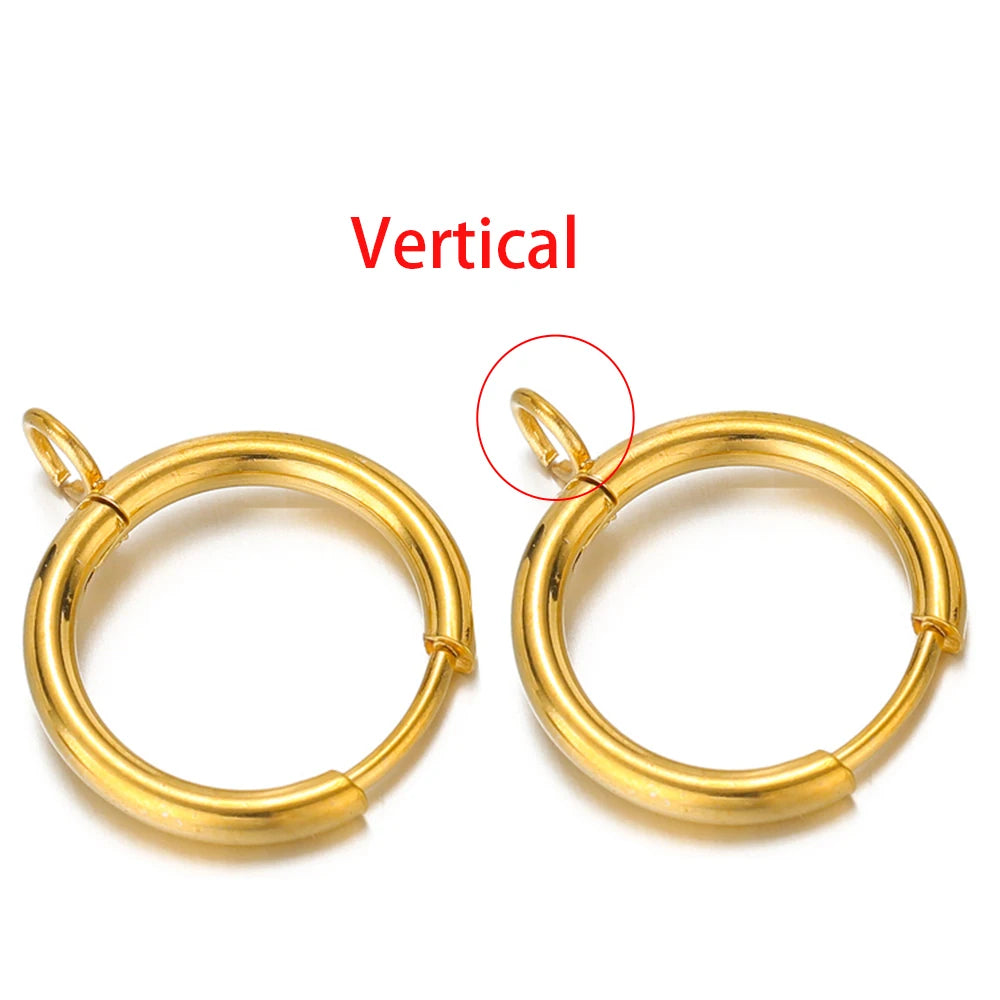 Gold-tone huggie hoops showing vertical loop post placement on the ring.