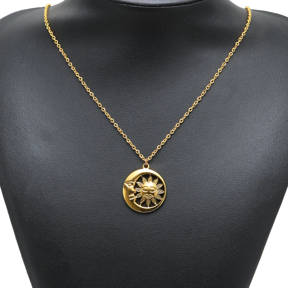 Gold sun charm pendant with smile face on a thin gold chain necklace