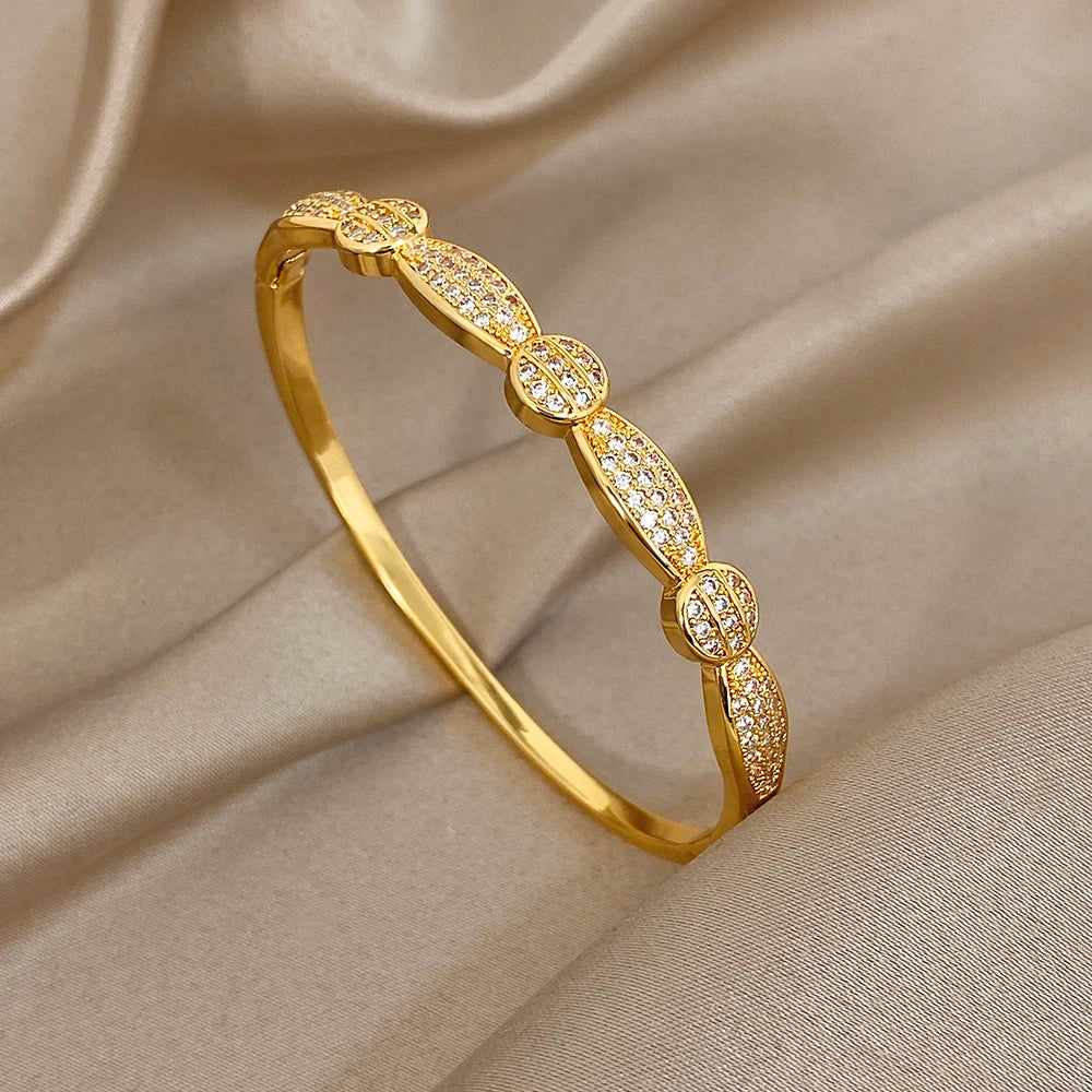 Gold-tone rhinestone geometric cuff bracelet, oval link bangle