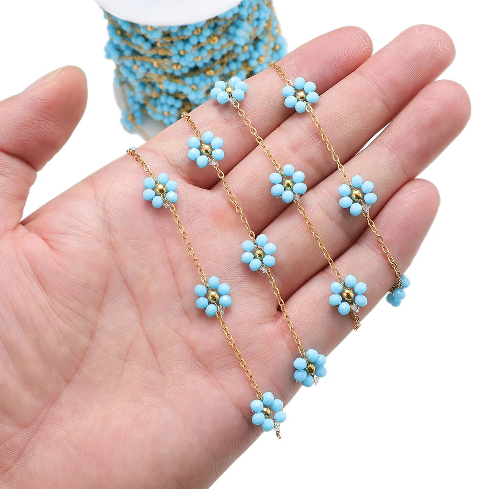 Gold-tone stainless steel daisy flower beaded satellite chain with light blue beads
