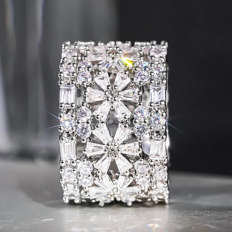 Square halo CZ cocktail ring with prong-set clear stones on silver-toned metal