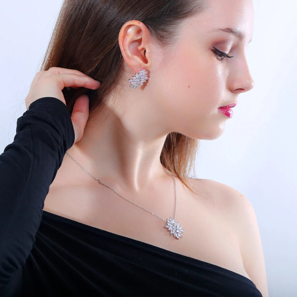 Silver-tone leaf zirconia necklace and earring modeled with a black top