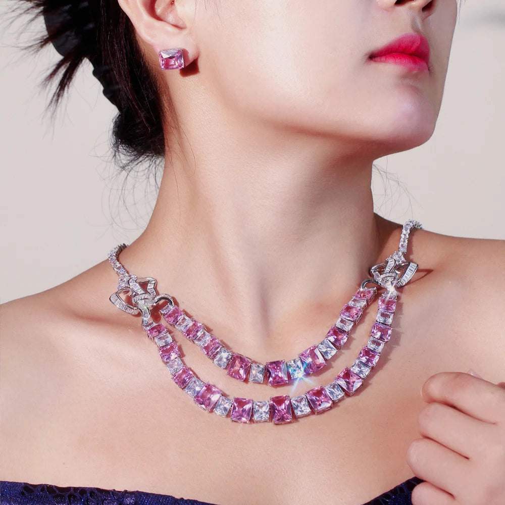 Pink square-stone double-layer necklace and matching stud earring worn