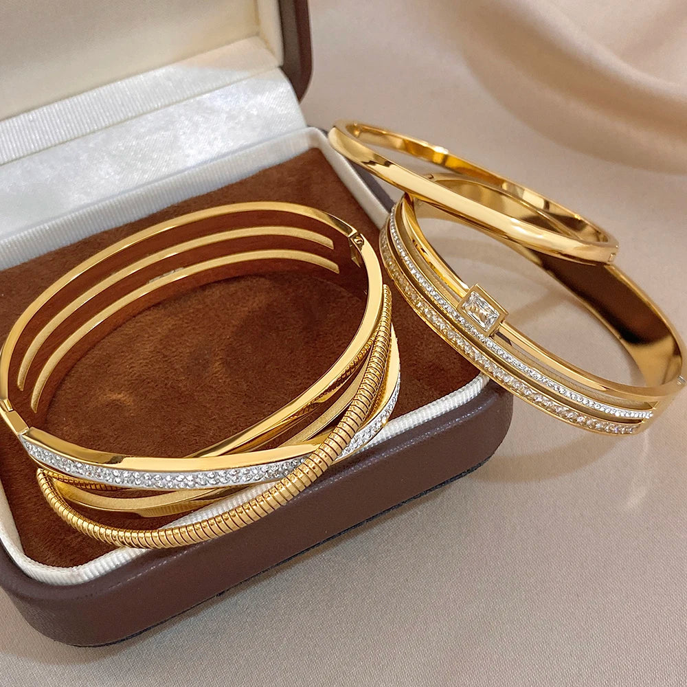 Gold plated stainless steel cuff bangles with clear zircon accents