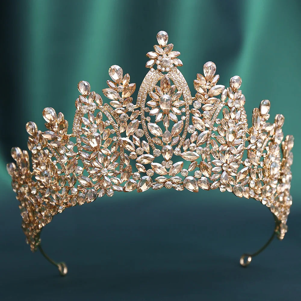 Gold-tone crystal tiara with leaf and teardrop stone details across the band
