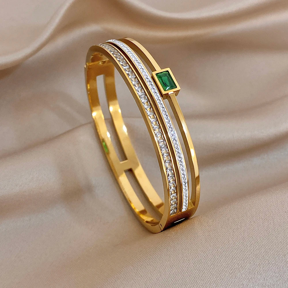 Gold-plated stainless steel cuff bracelet with green zircon and white stones