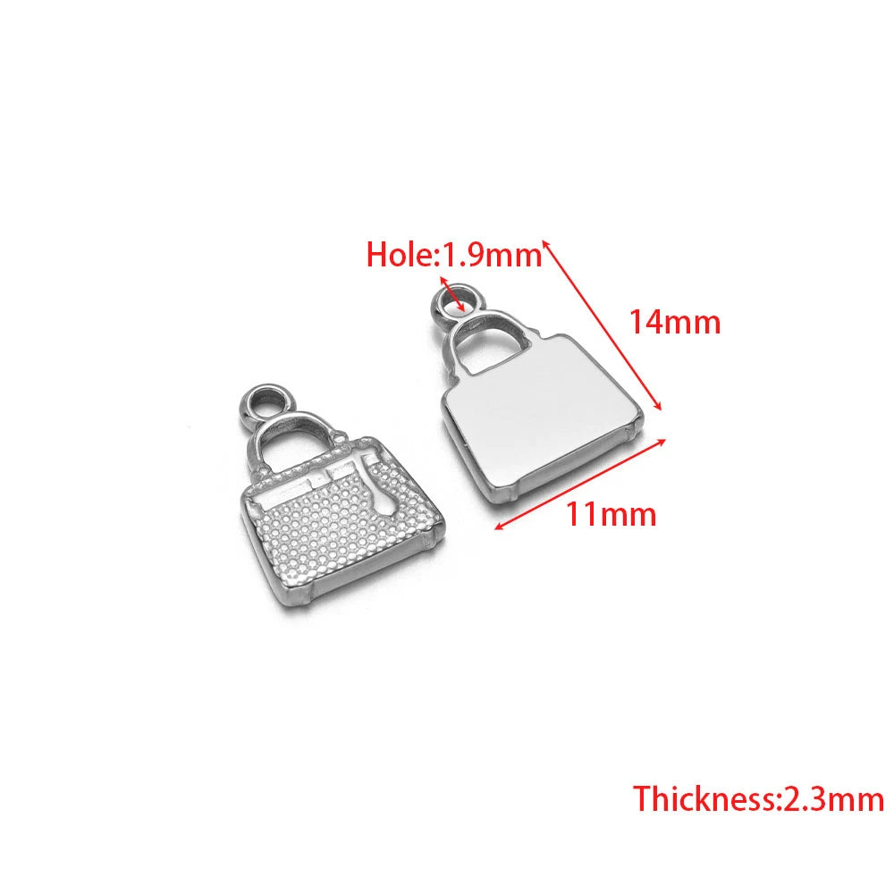 Stainless steel heart and purse charms with jump ring holes, silver-tone pair