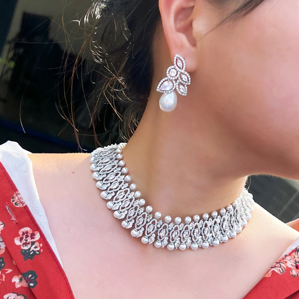 Silver-tone cubic zirconia choker with pearl drop earrings on model