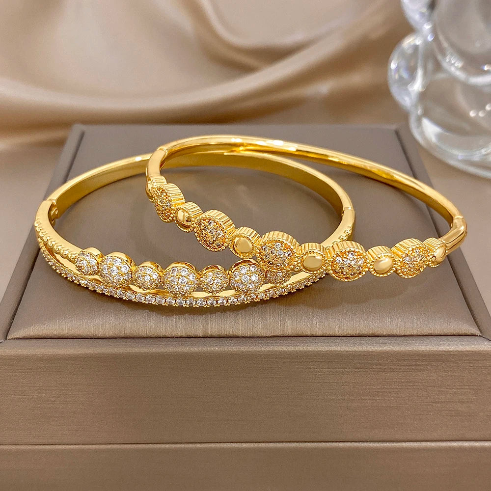 Two gold-plated beaded zircon bangle bracelets