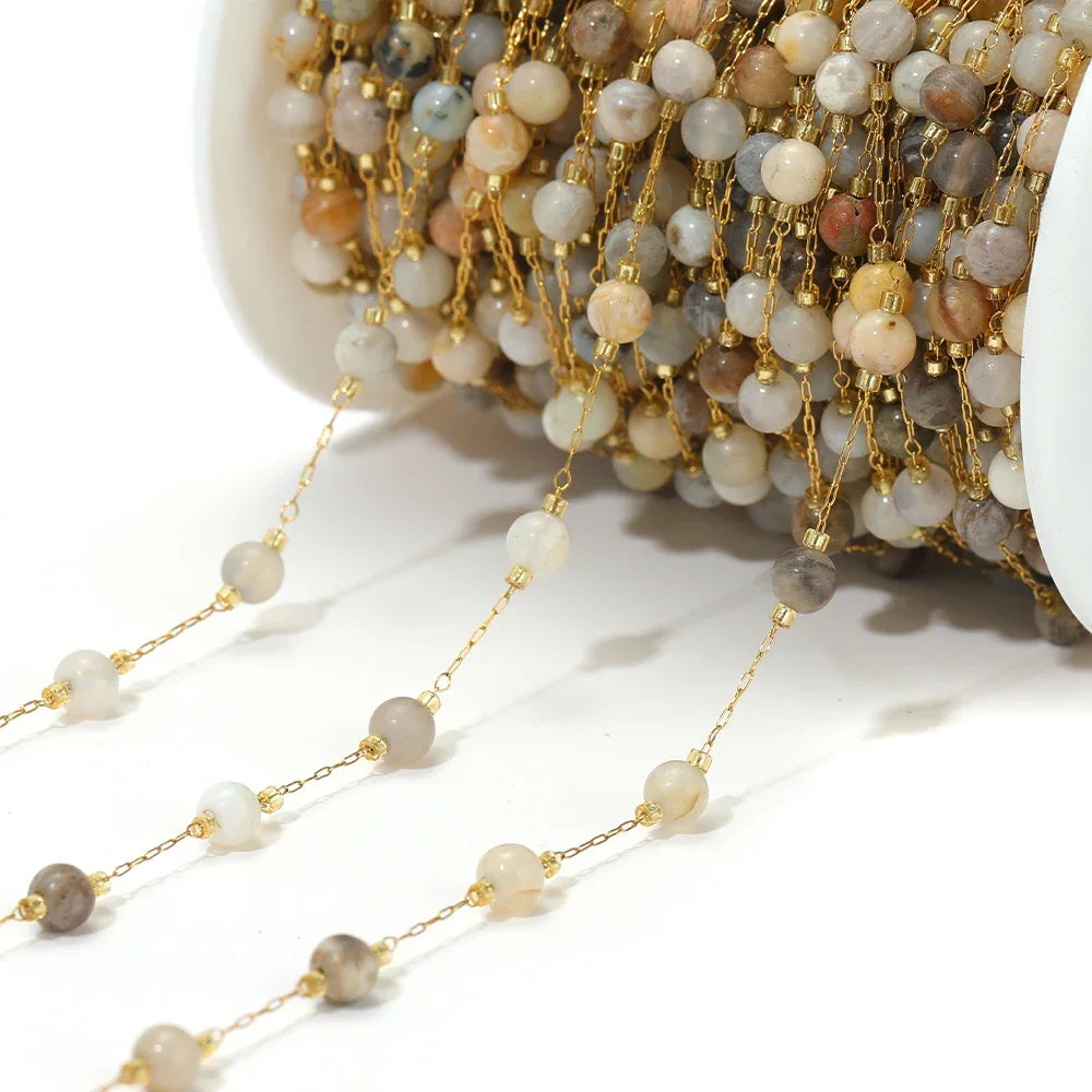 Gold-tone bead chain with small pearl and gray gemstone beads on a strand