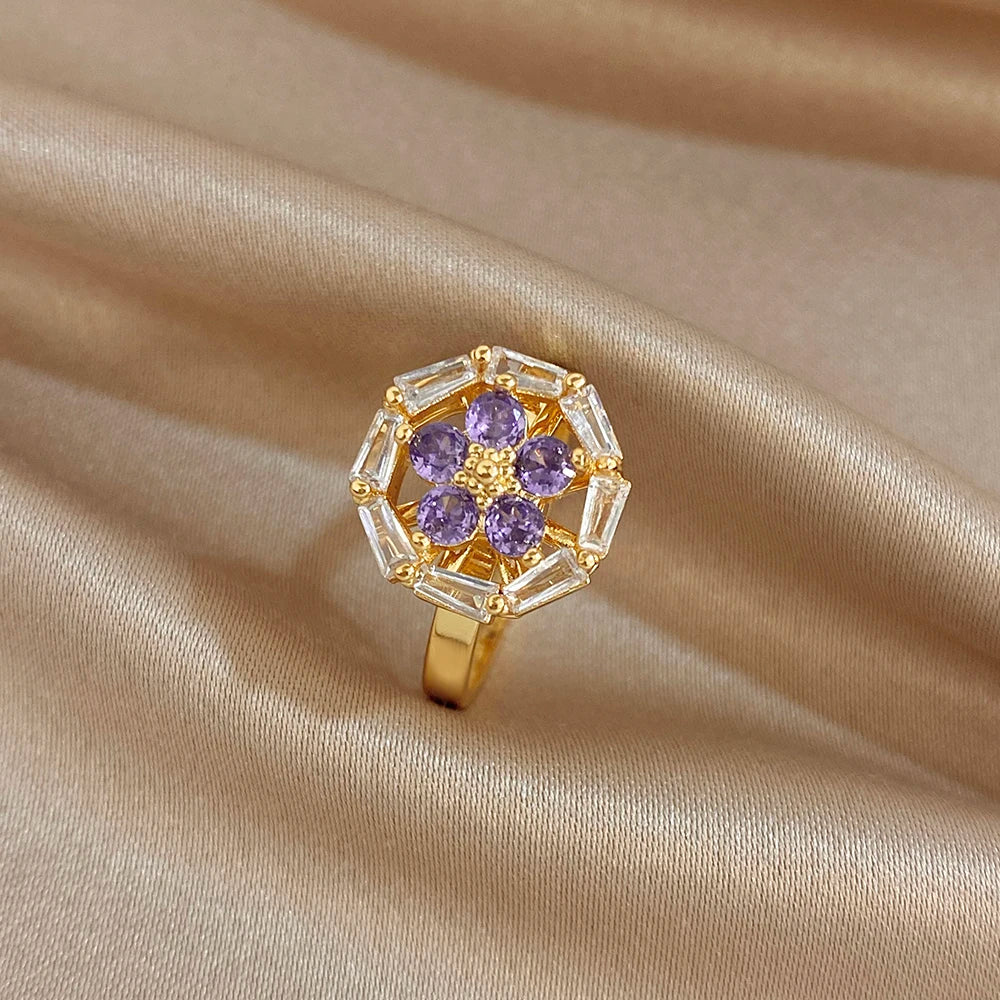 Gold-plated copper flower zirconia ring with clear blossom and tiny heart accents