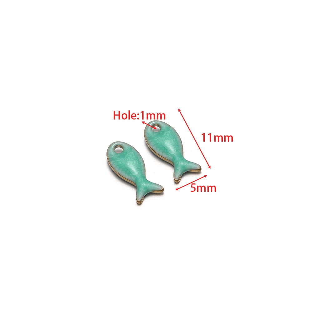 Pair of teal double-sided fish charms with round hanging holes
