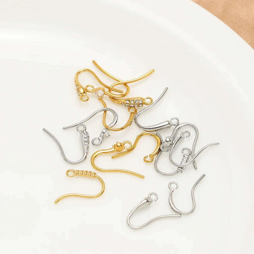 Bulk set of ear wire hooks in gold and silver tones with crystal-stone details