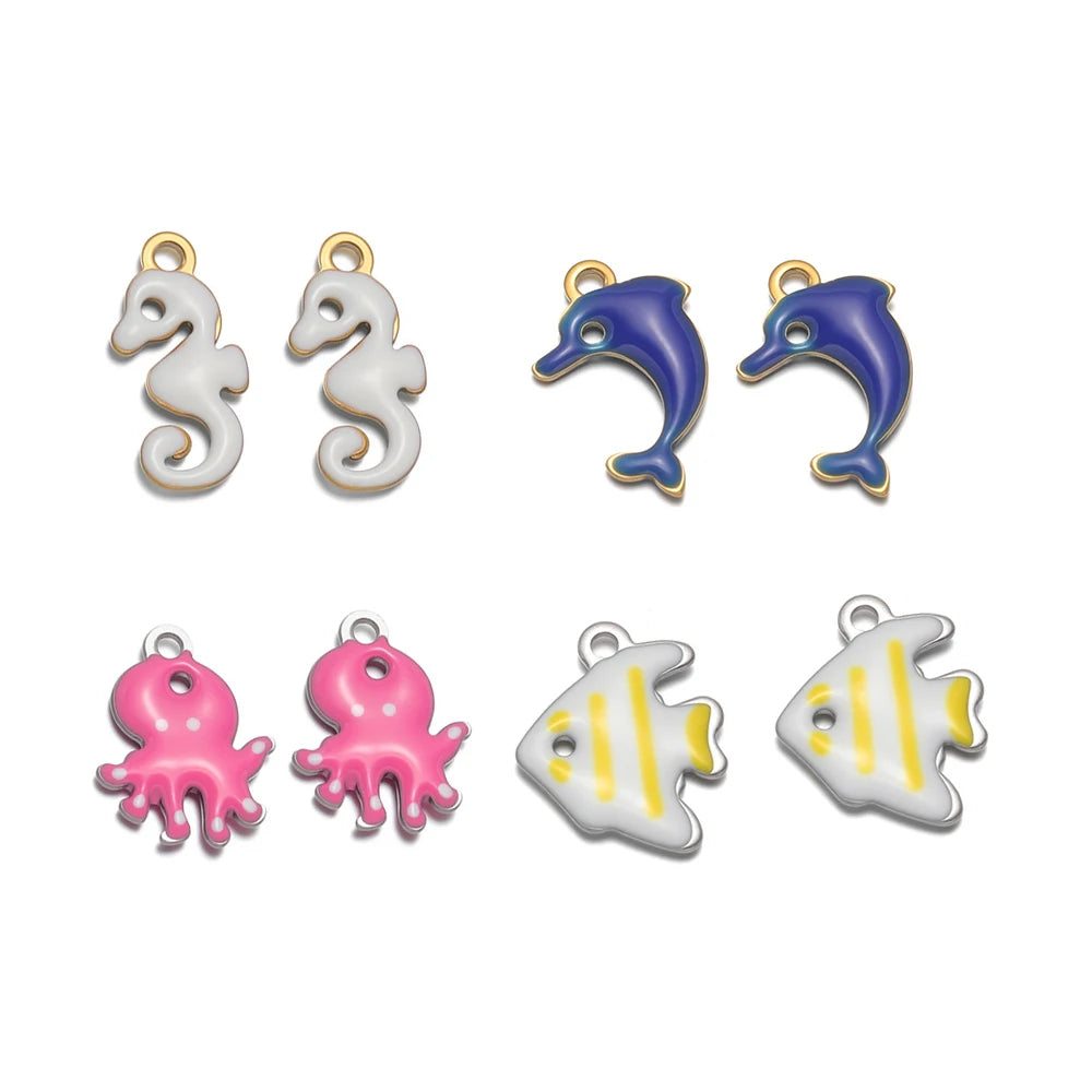 Assorted marine animal charm pendants: dolphins, octopus, and striped fish with loops