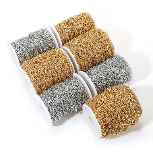Embossed oval link chain bulk in gold and silver on white spools, 4.5mm