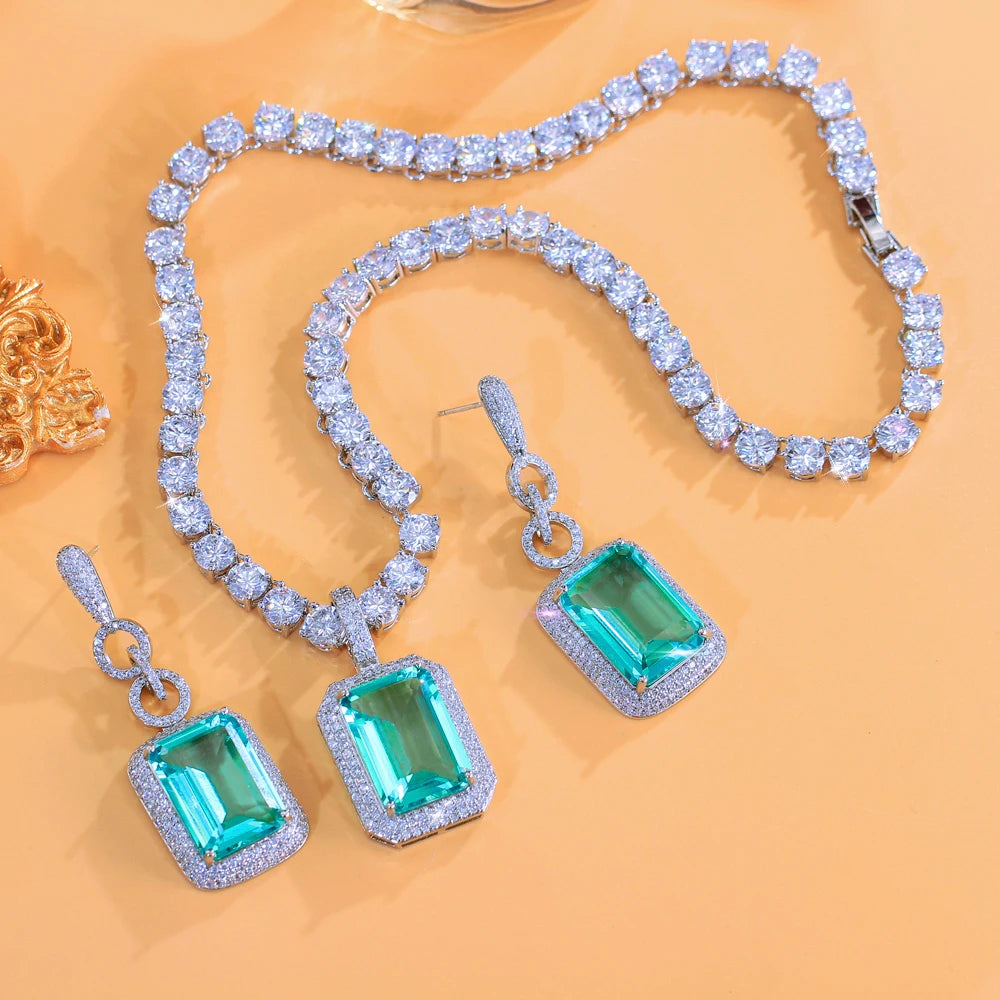 Tennis jewelry set with green rectangular cubic zirconia necklace and earrings