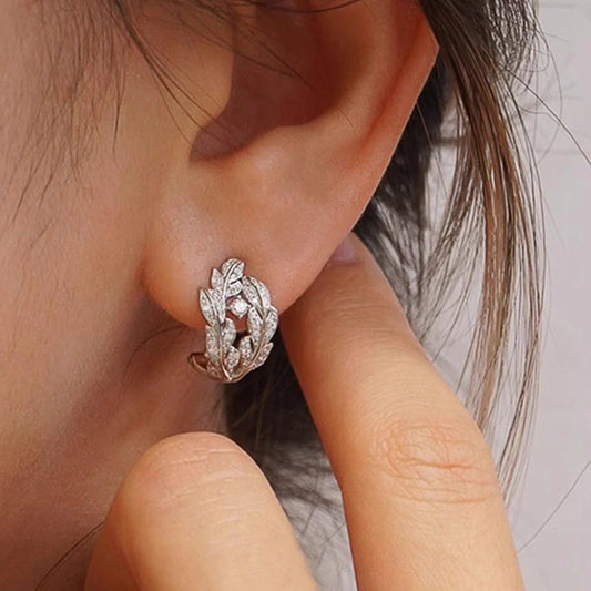 Silver leaf hoop earrings with cubic zirconia, detailed pave design